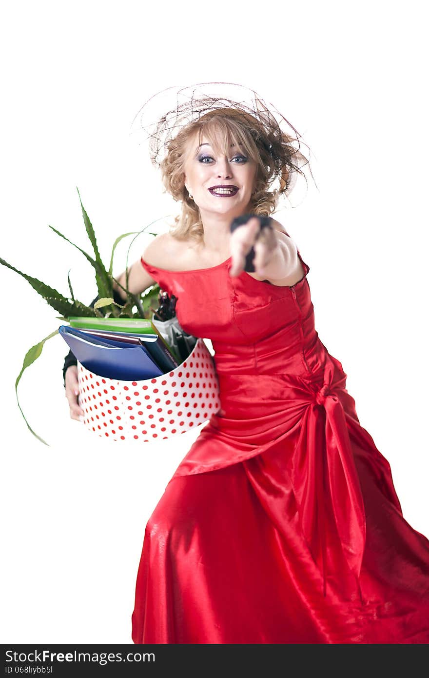 Fired actress in a red dress with a box of things express her emotions on a white background. Fired actress in a red dress with a box of things express her emotions on a white background