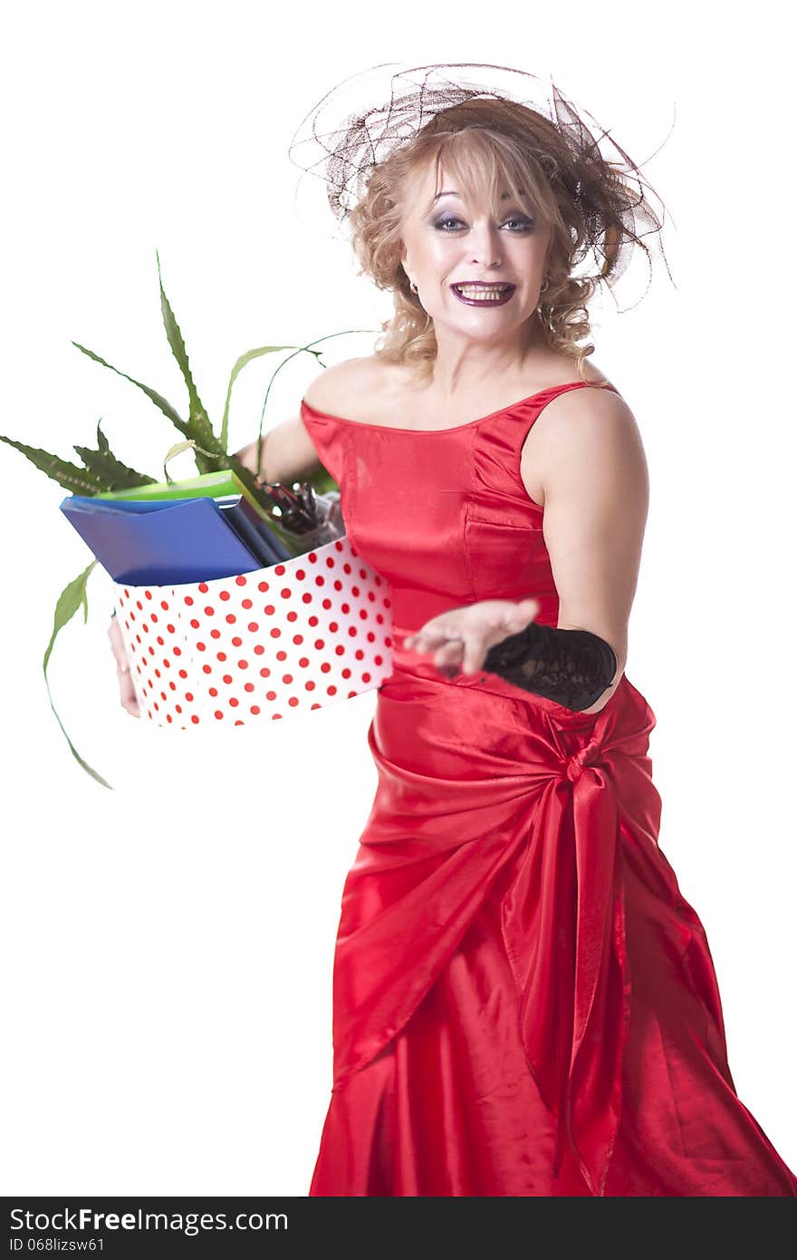 Fired actress in a red dress with a box of things express her emotions on a white background. Fired actress in a red dress with a box of things express her emotions on a white background