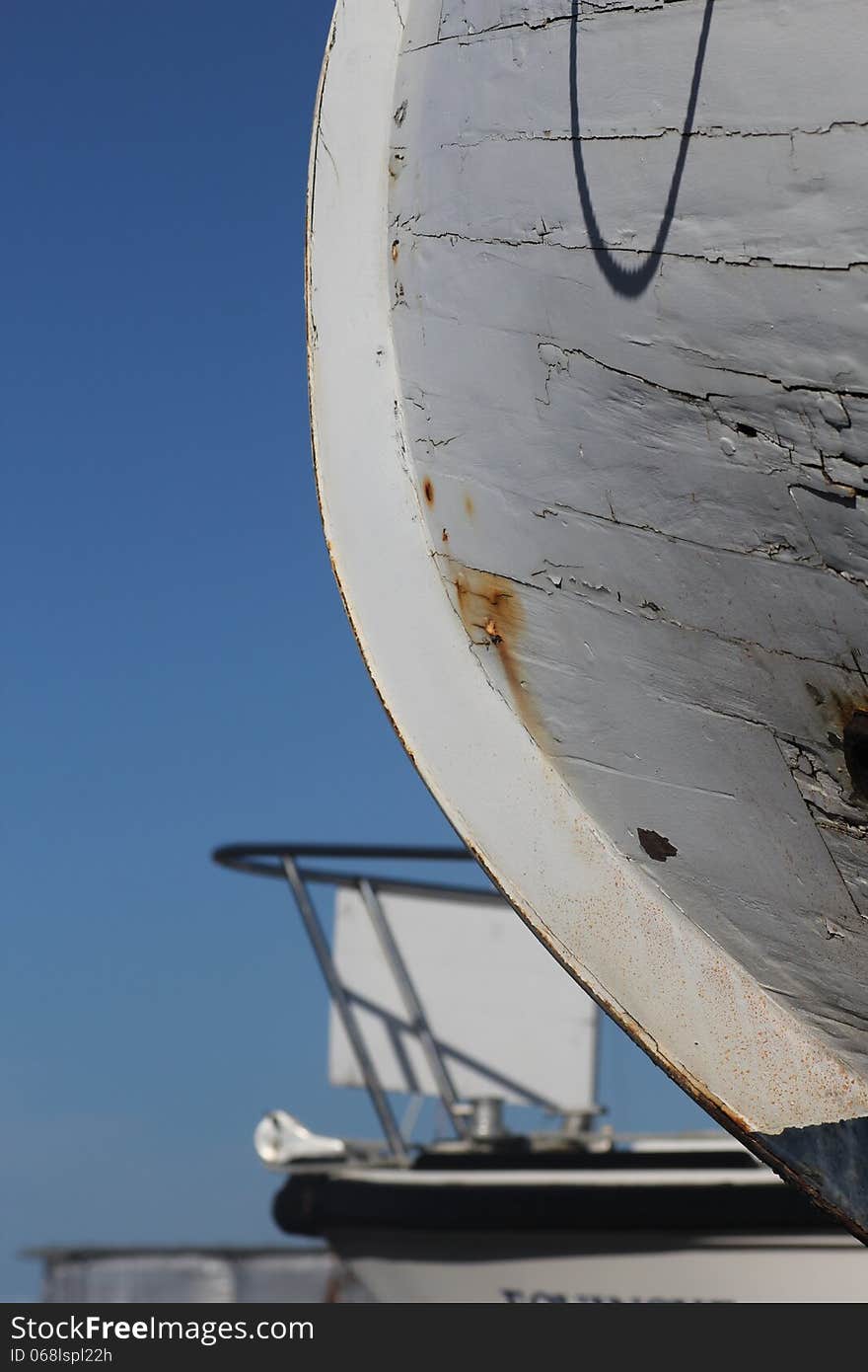 Detail of boat hull in dry dock marina.