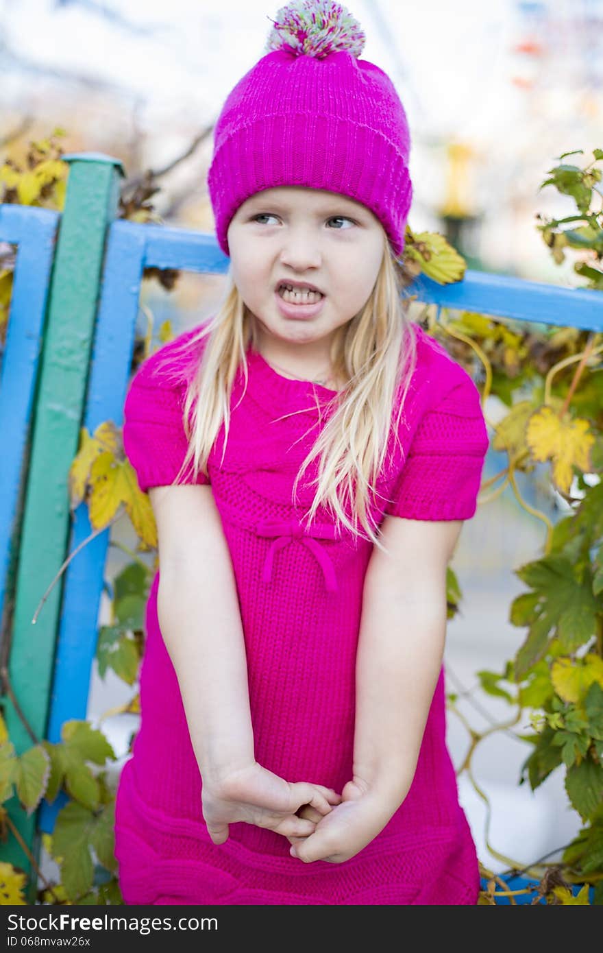 Funny little girl with blond hair