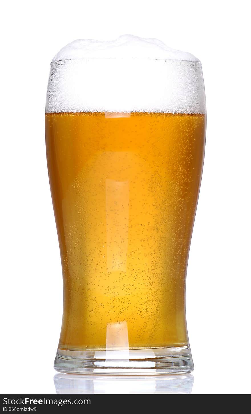 Glass of lager with a white background and white floor support. Glass of lager with a white background and white floor support