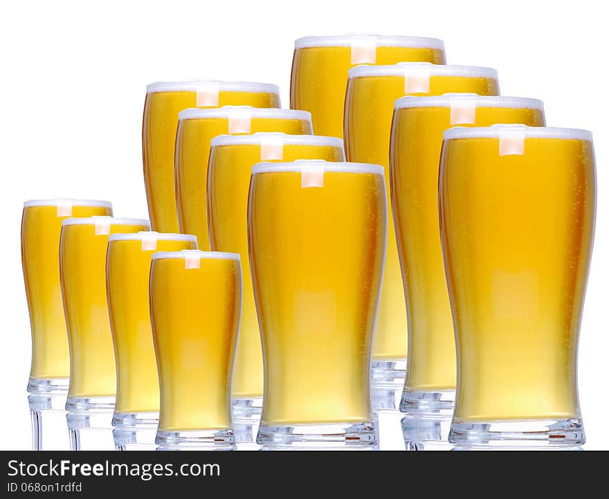 Tankards of lager with white background and white floor support. Tankards of lager with white background and white floor support