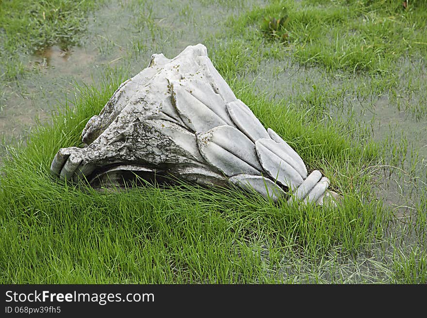 Ruined antique column in a rainy day