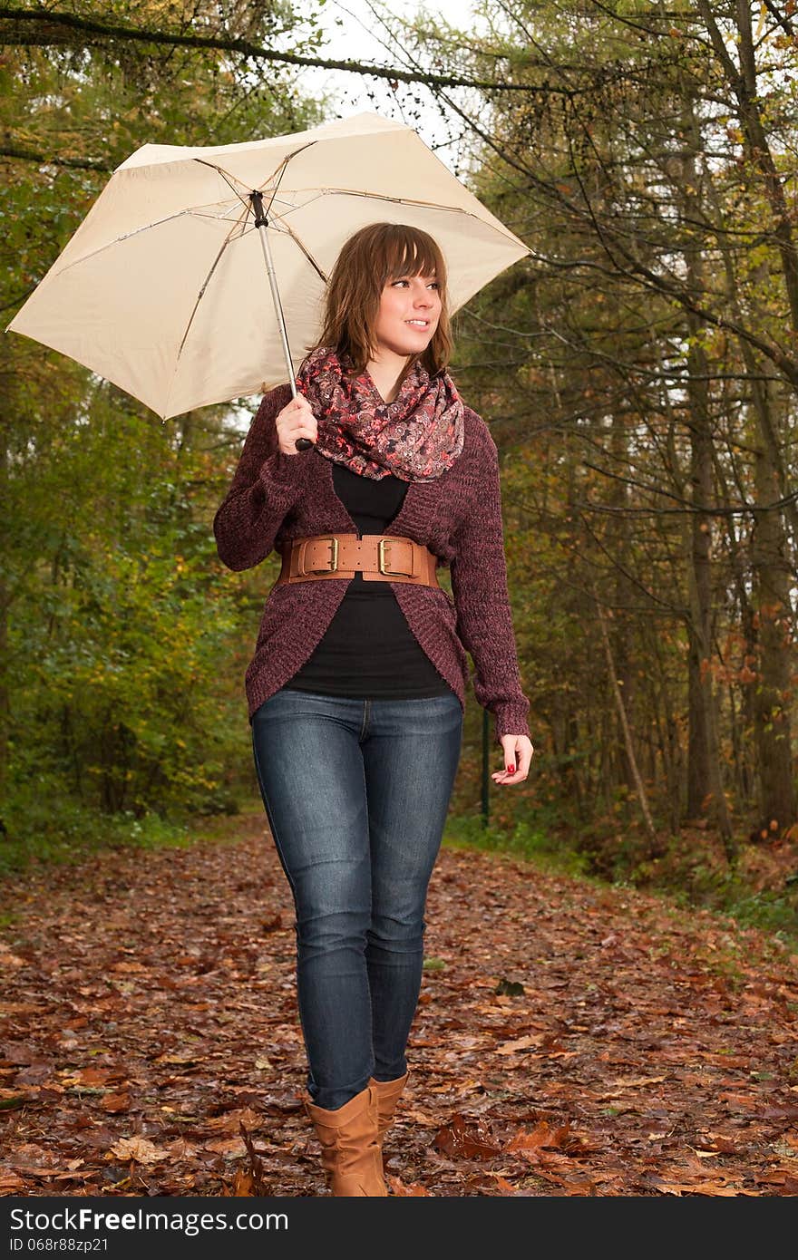 Girl is enjoying the view with an umbrella