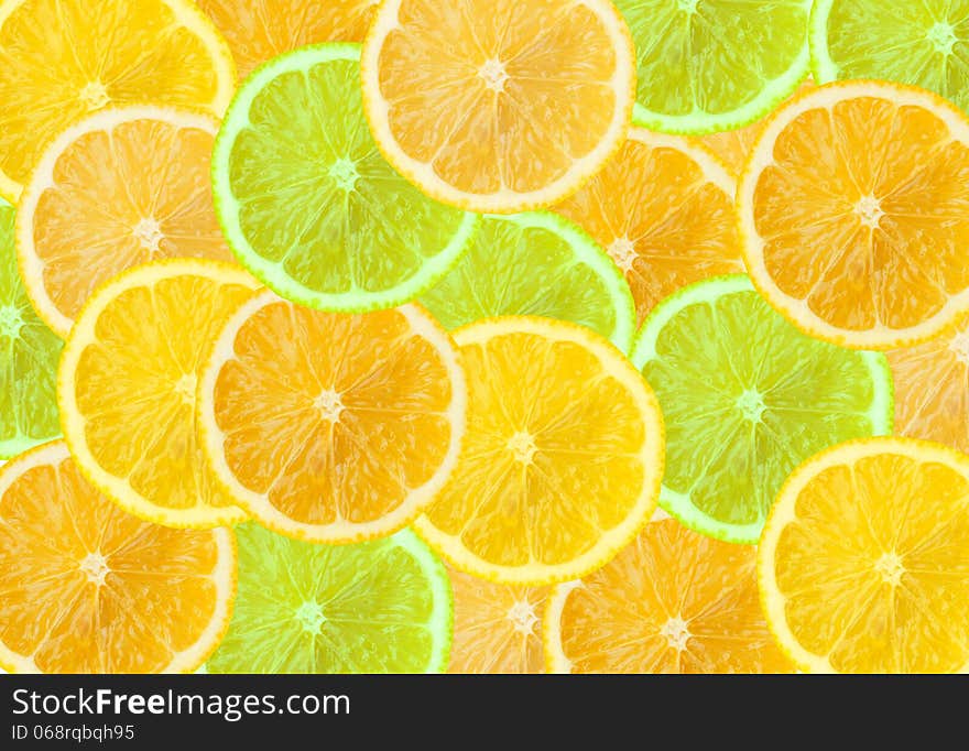 Abstract three-color background with citrus fruit of grapefruit, orange and lemon slices