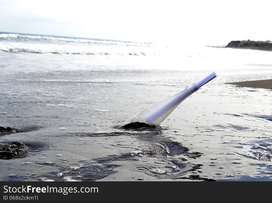 Bottle in the sand of beach. Bottle in the sand of beach