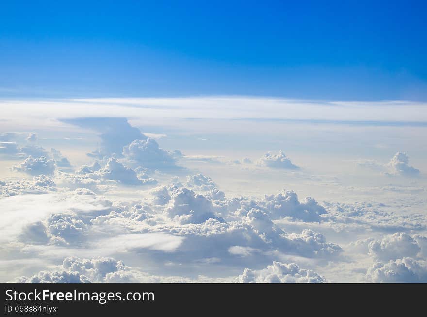 Bright blue sky with puffy white clouds.