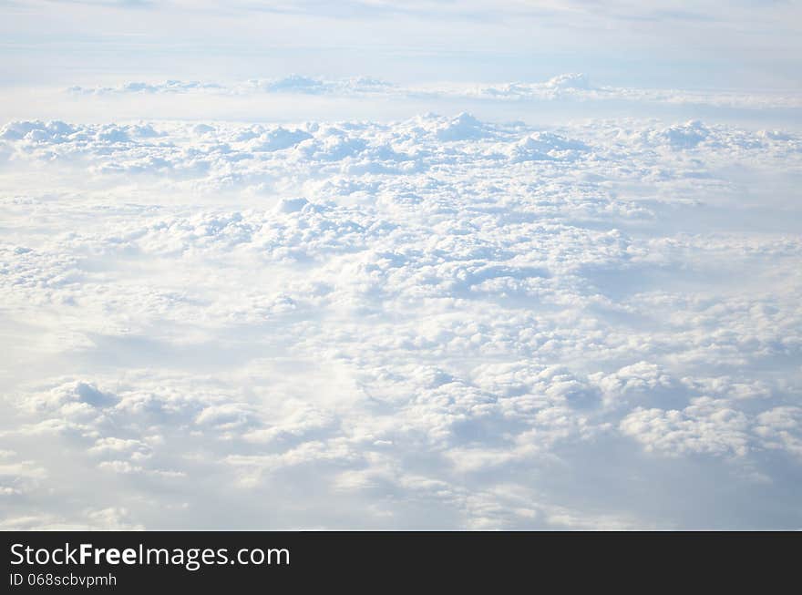 Soft puffy clouds from plane, above Thailand