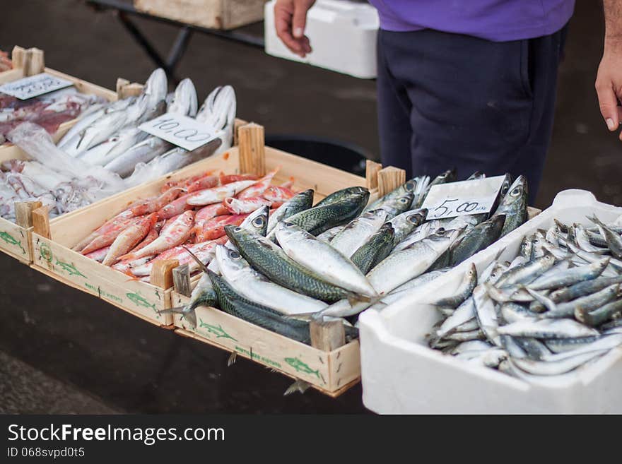 A man selling fresh fish in the fish market