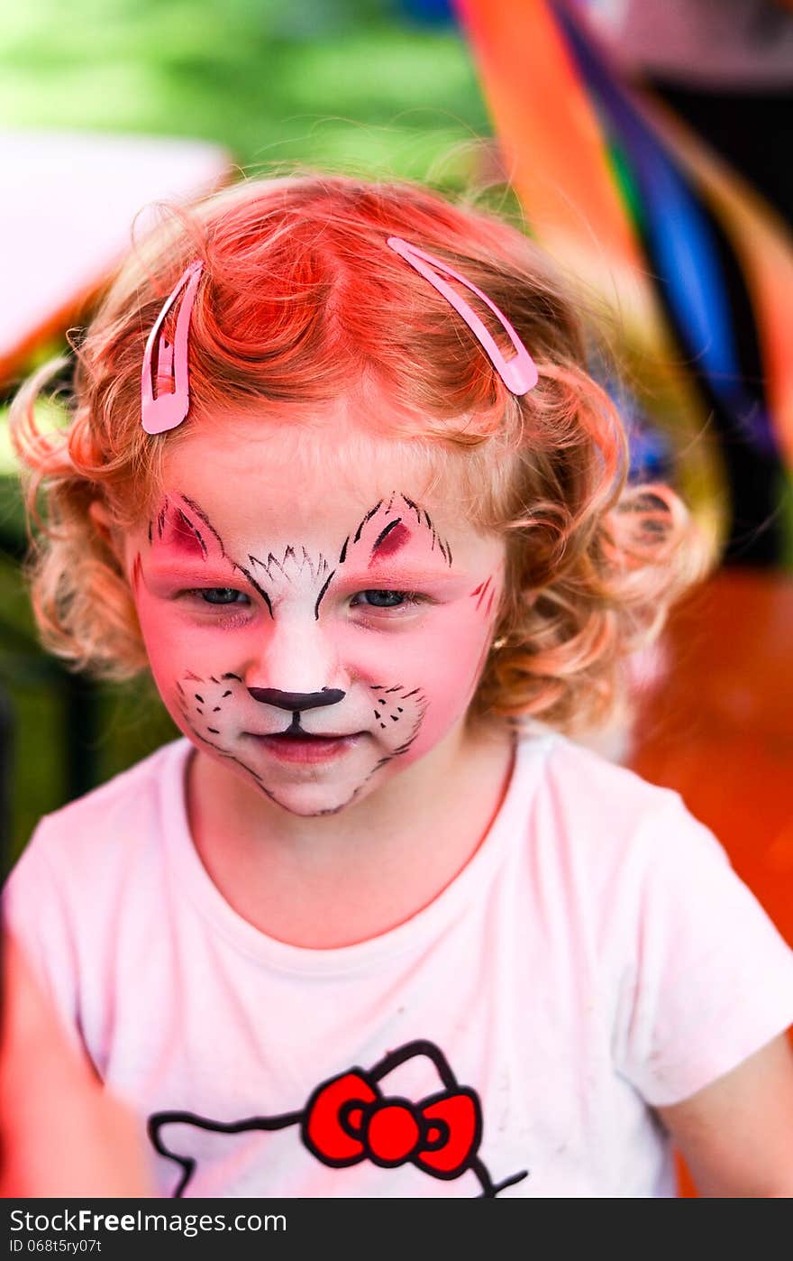 Small girl with painted face. Small girl with painted face