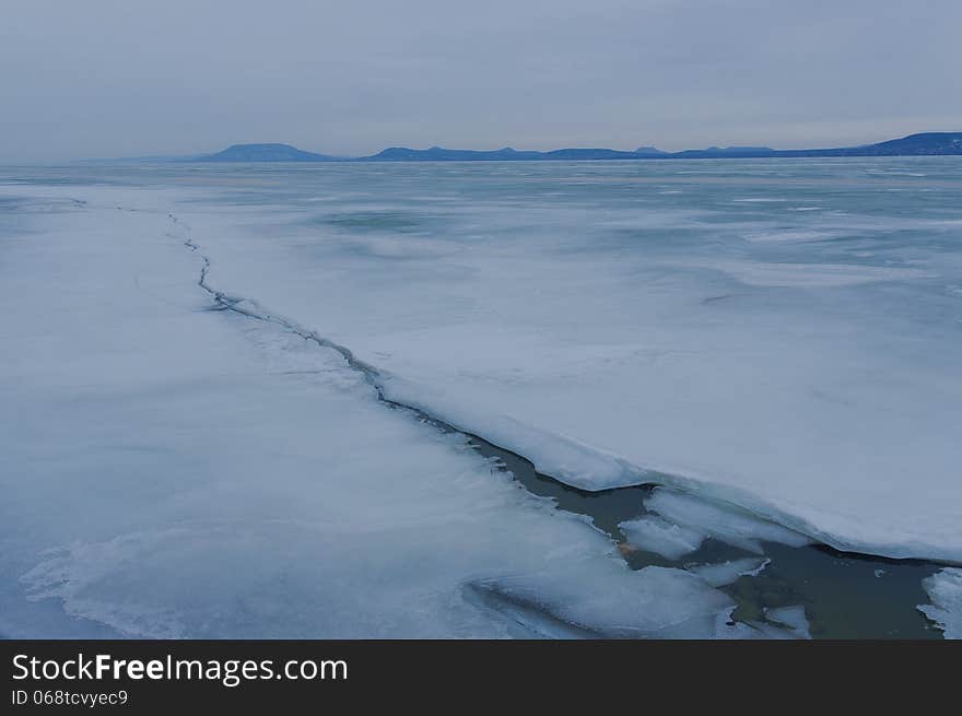 Frozen lake with mountains. Frozen lake with mountains.