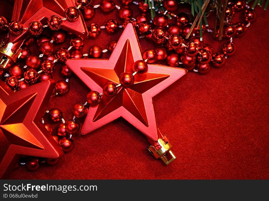 Red Cristmas star decoration on red background. Red Cristmas star decoration on red background.