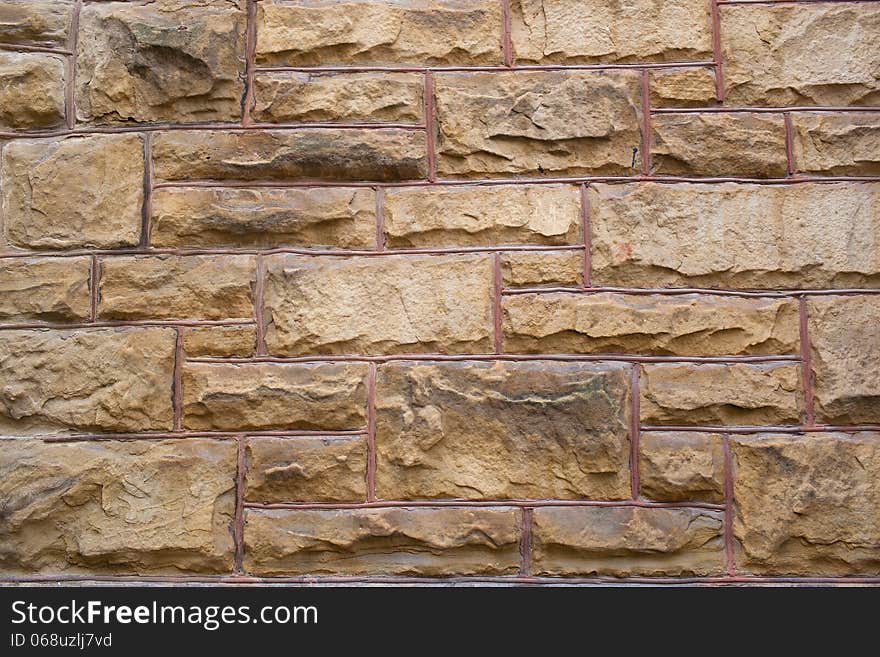 Brown brick wall with large blocks