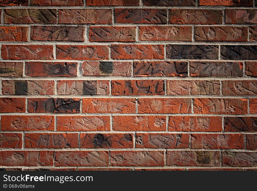 Brown brick wall with marks