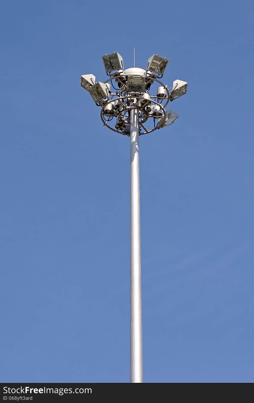 A single electricity post with blue sky