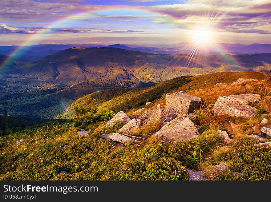 Mountain landscape. valley with stones on the hillside. forest on the mountain under the beam of light falls on a clearing at the top of the hill. Mountain landscape. valley with stones on the hillside. forest on the mountain under the beam of light falls on a clearing at the top of the hill.