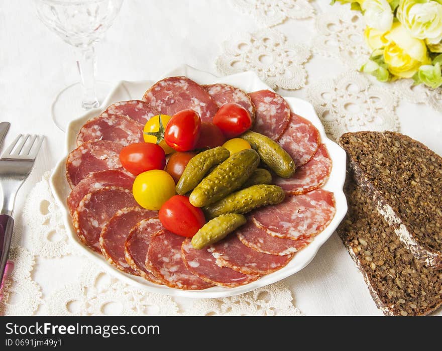 Lithuanian kindziuk on the holiday table with dark bread. Lithuanian kindziuk on the holiday table with dark bread