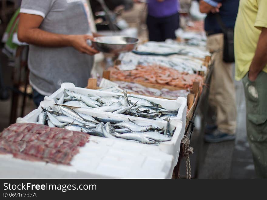 A man selling fresh fish in the fish market