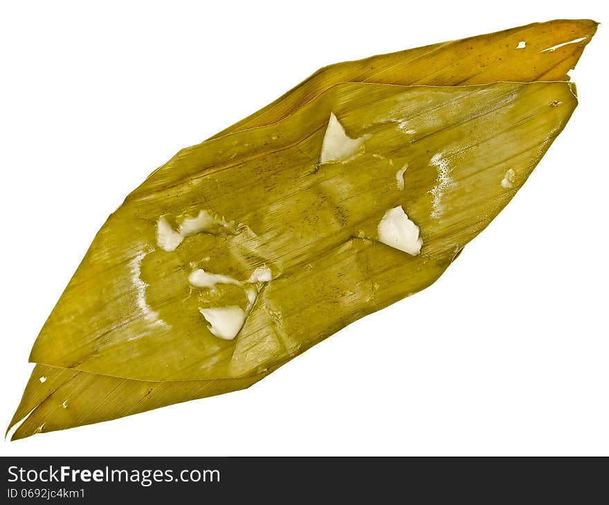 Bare banana leaf package after eating on white background. Bare banana leaf package after eating on white background