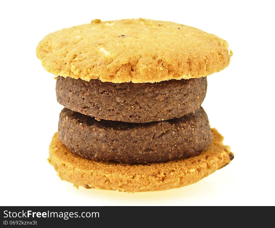 Compound of brown and yellow cookies in double hamburger shape on white background. Compound of brown and yellow cookies in double hamburger shape on white background