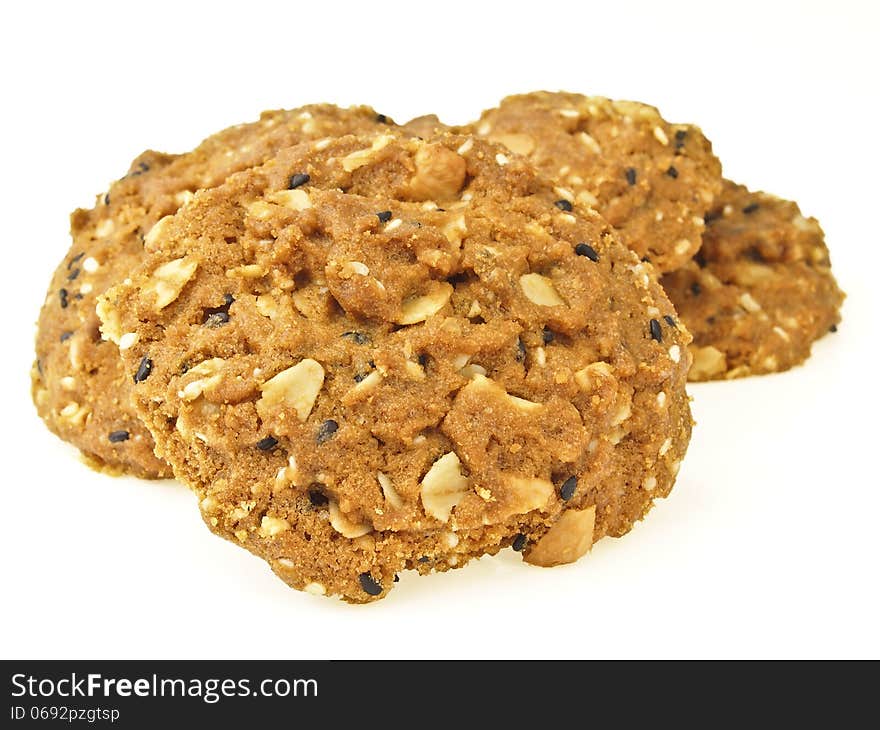 Closeup of pile delicious whole grains cookies on white background. Closeup of pile delicious whole grains cookies on white background