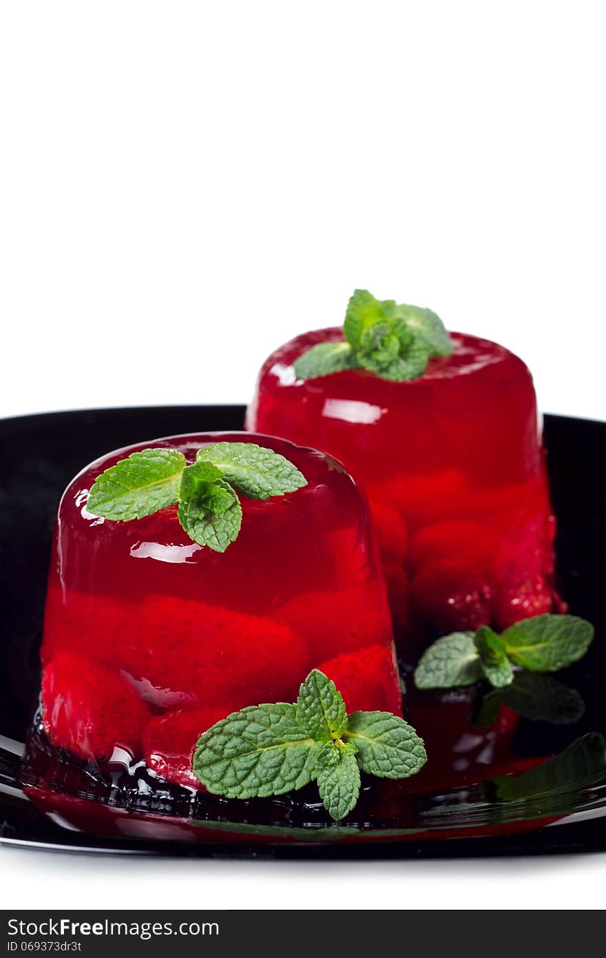 Two strawberry jelly isolated on white background.