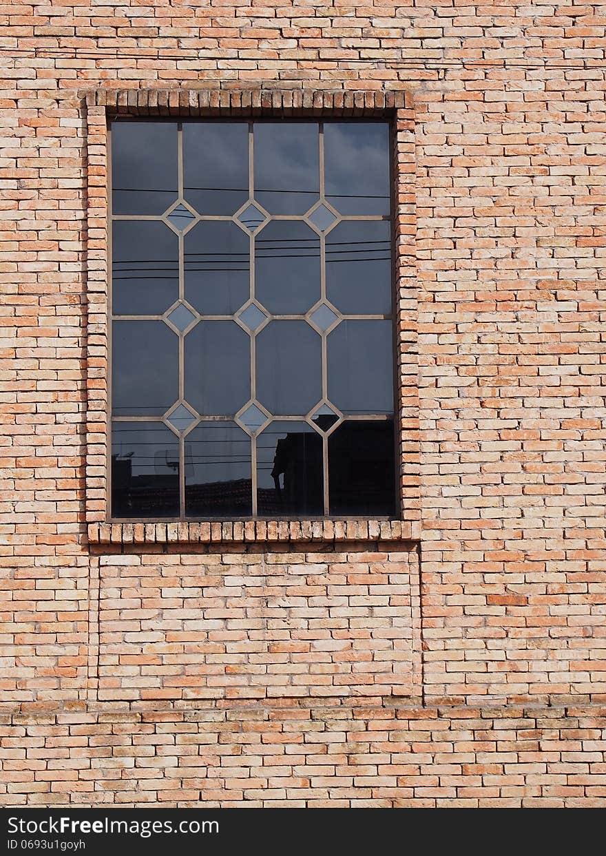 A glass window and a old brick wall - Amazonia - Brazil