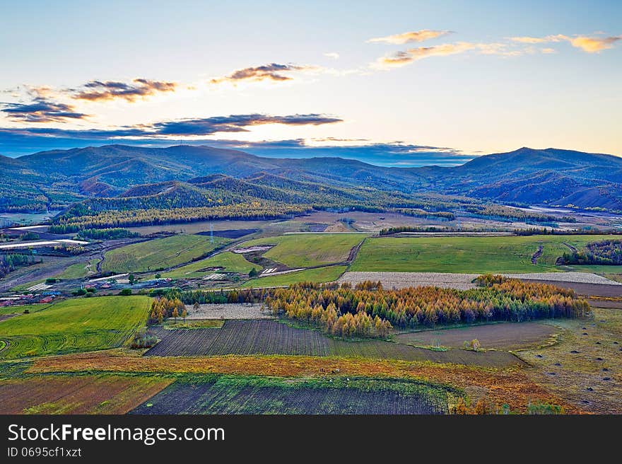 Hills and autumn forest sunset