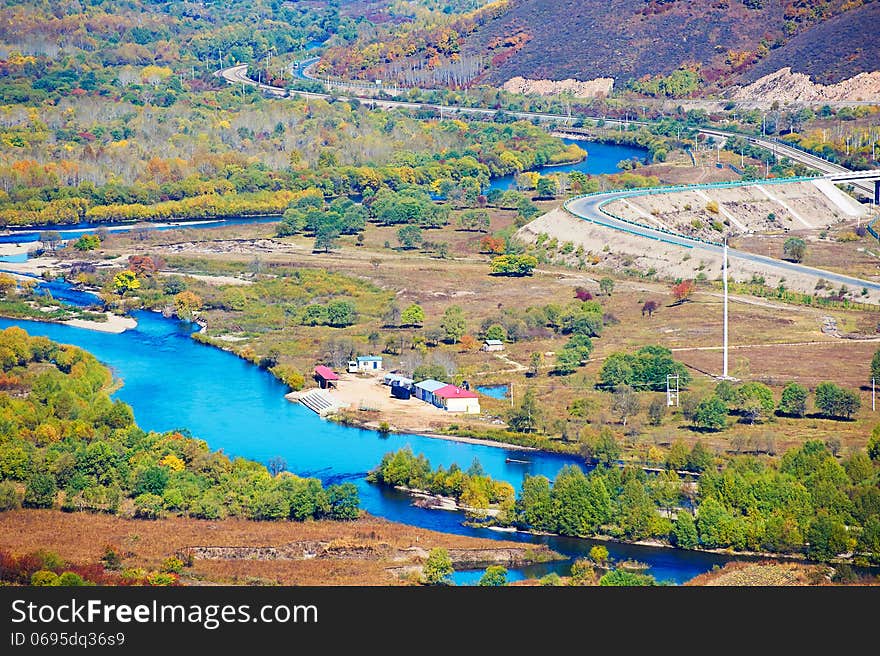 The blue river and  a tortuous road