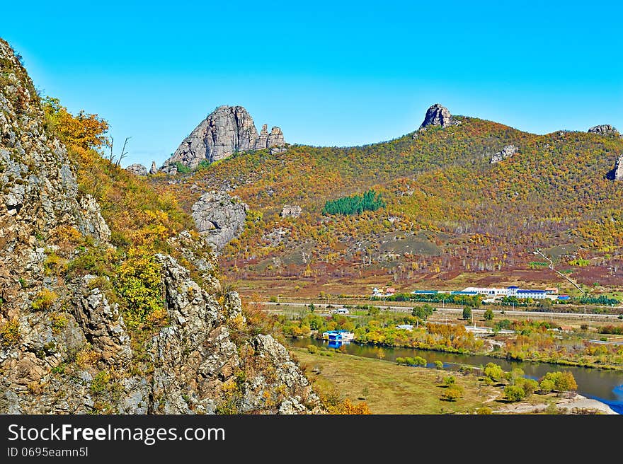 The lama hill and autumn forest river