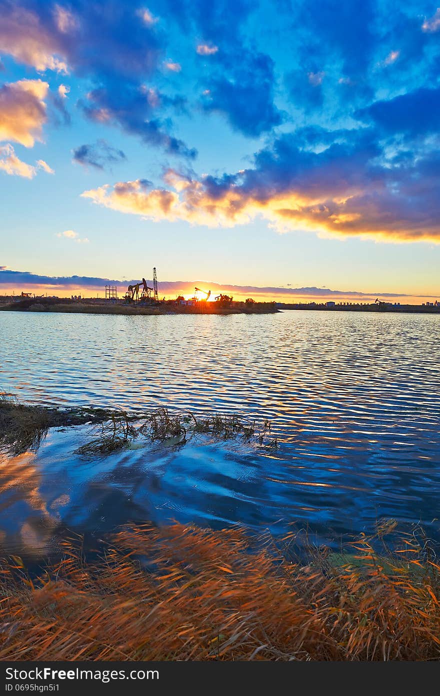 The golden grass and lake water in the afterglow