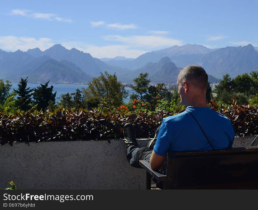 Antalya, observation deck. Tourist looks at the landscape. Antalya, observation deck. Tourist looks at the landscape