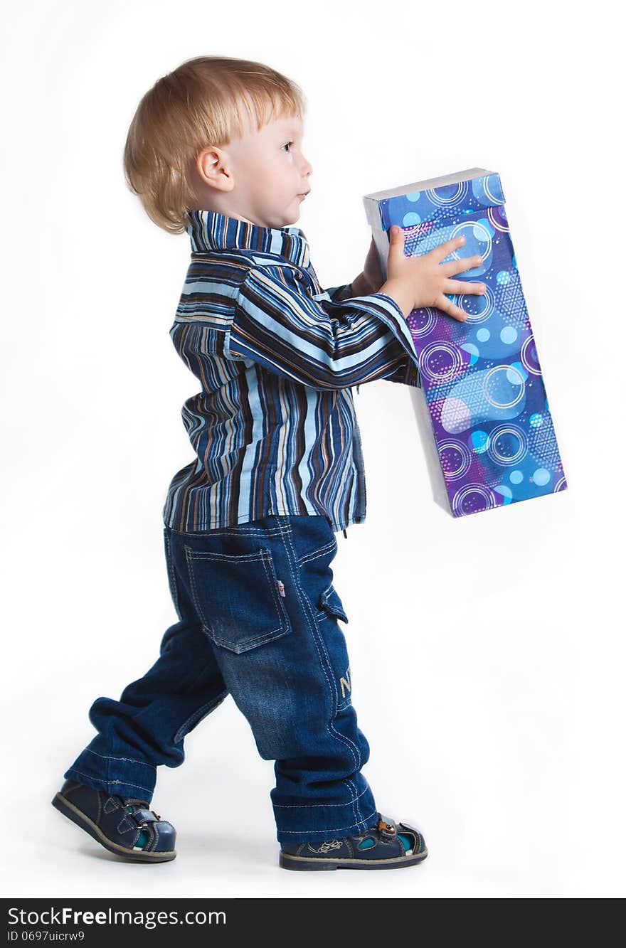 Little Boy Going With Big Box In His Hands