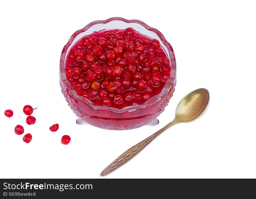 Viburnum berries in syrup on a white background.