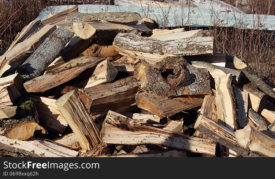 Haphazard pile of firewood just freshly split. Haphazard pile of firewood just freshly split