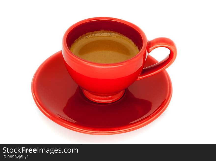 A cup of Italian espresso. Cup and saucer with red color inside the coffee ready to drink.