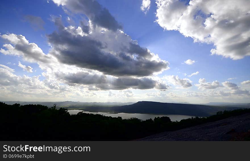 Cloudscape sun burst ray timelapse vivid blue sky setting sun