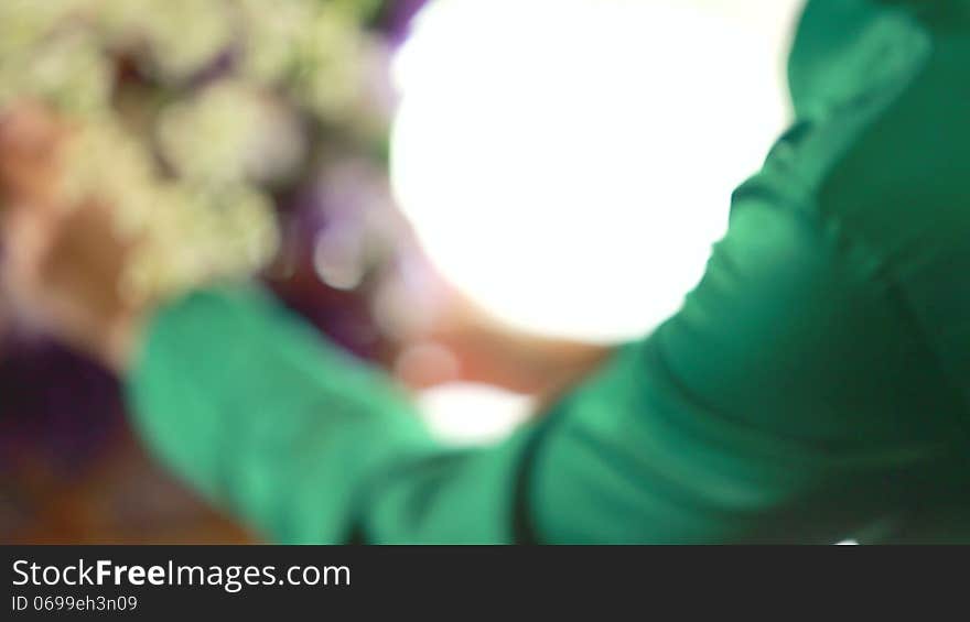 Woman florist arranging flower bouquet