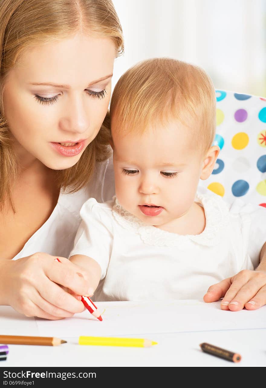 Mother and baby draw color pencil