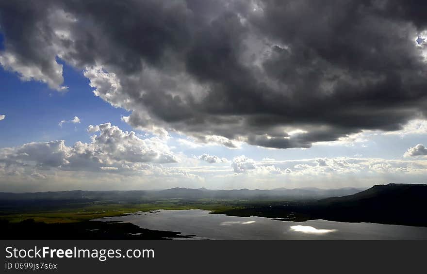 Cloudscape sun burst ray timelapse vivid blue sky setting sun