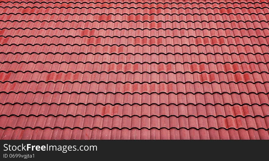 Red tiles roof background.