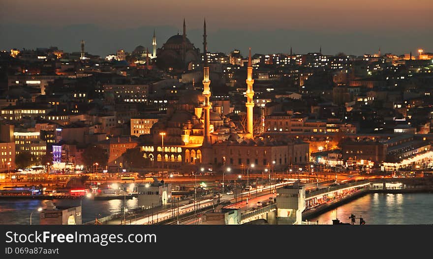 Istanbul Turkey Galata bridge at rush hour, mosque and Eminönü ferry pier by night. Istanbul Turkey Galata bridge at rush hour, mosque and Eminönü ferry pier by night