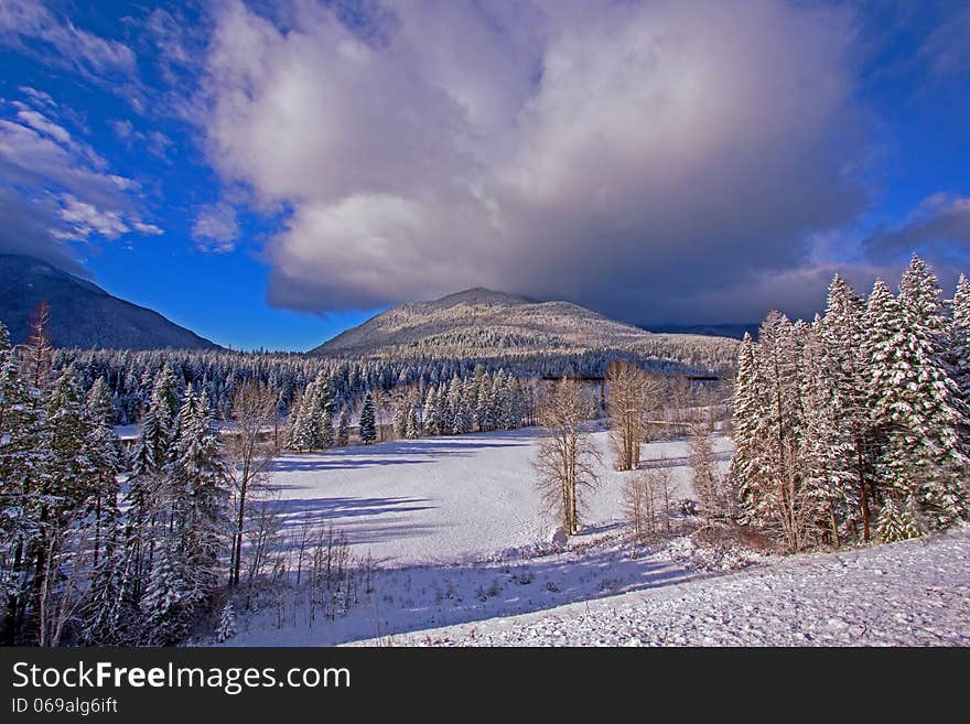 This image of the new snow fall was taken in the morning near Coram, Montana and shows a railroad bridge over the Flathead River. This image of the new snow fall was taken in the morning near Coram, Montana and shows a railroad bridge over the Flathead River.