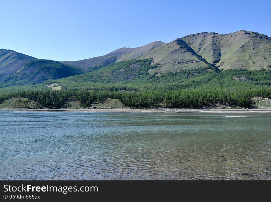 Sunny Landscape Of The River In Mountains.