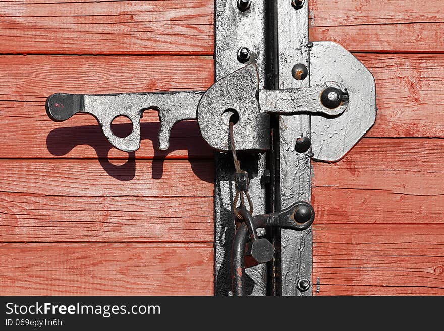 Closeup of a vintage wooden latch on a building