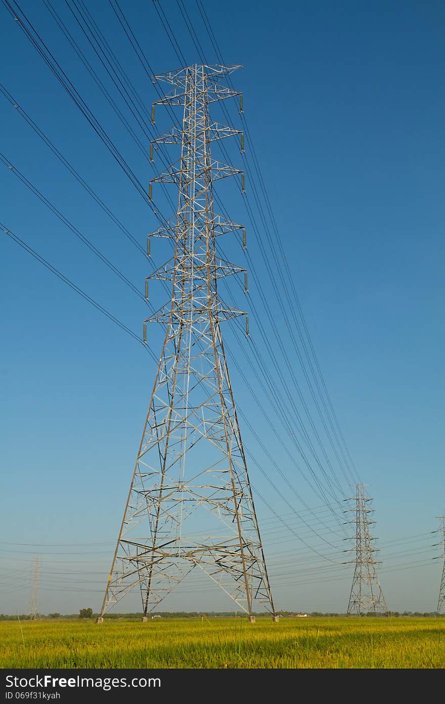 High voltage tower with blue sky background