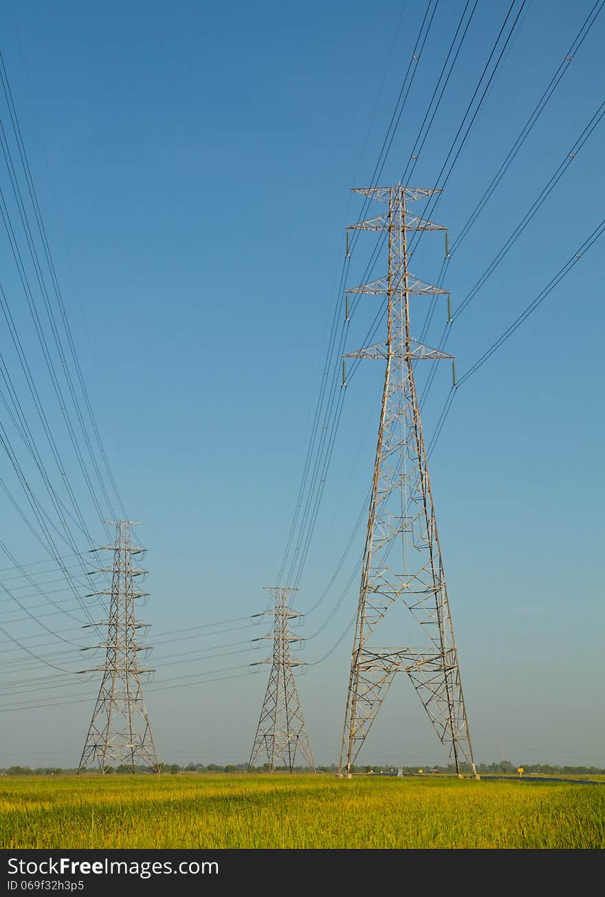 High voltage tower with blue sky background