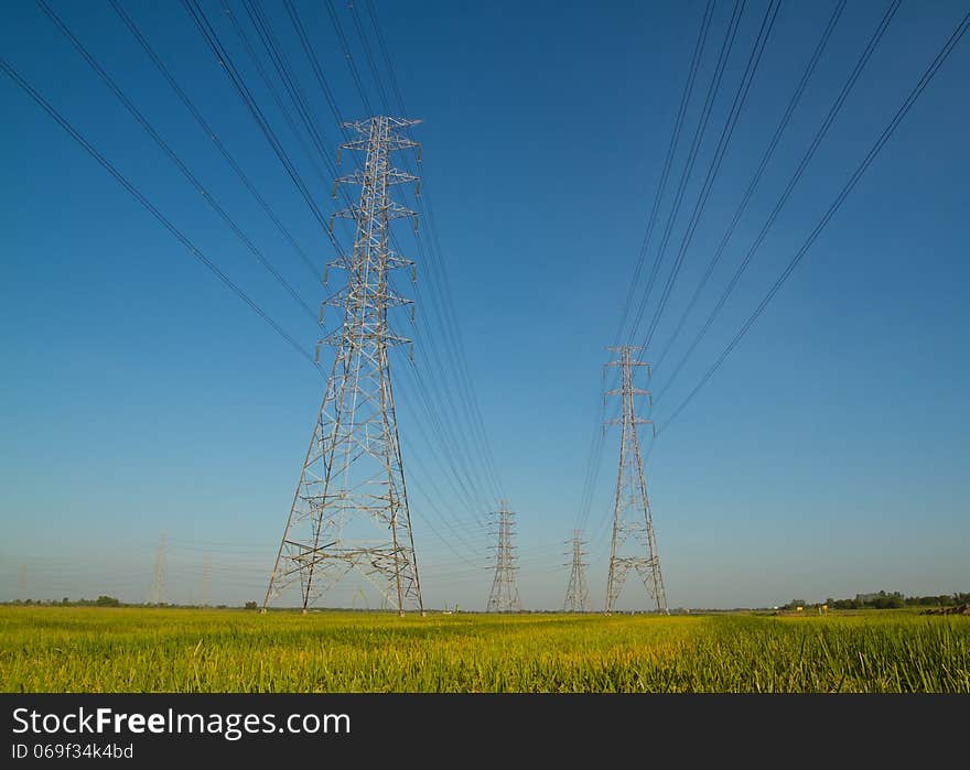 High voltage tower with blue sky background