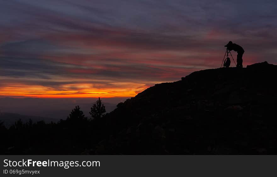 A photographer shoots sunrise