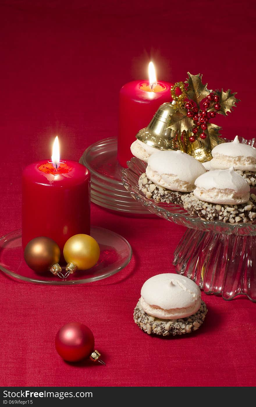 Christmas decoration with candles ribbons and cookies